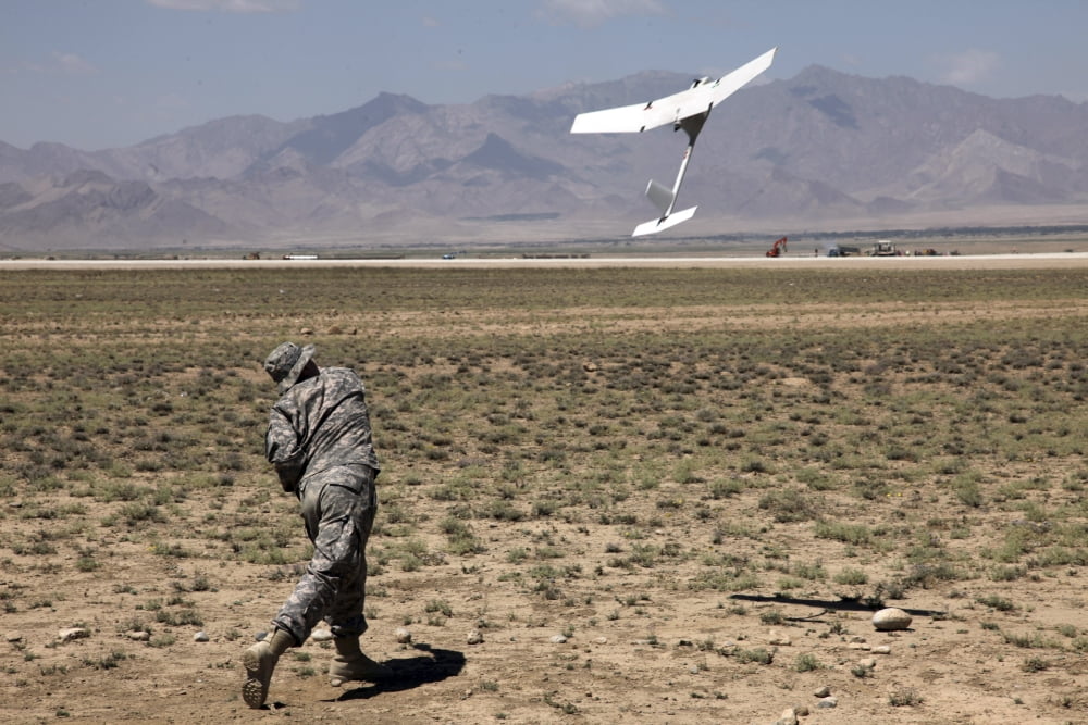 US Army soldier launches an RQ-11 Raven unmanned aerial vehicle Canvas Art - Stocktrek Images (35 x 23)