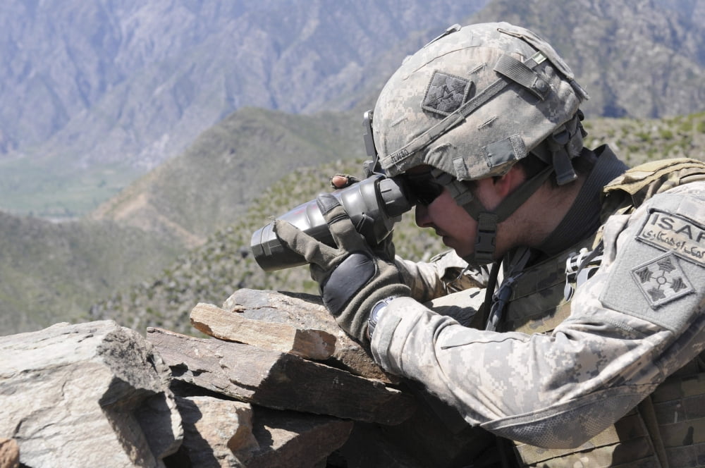 US Army soldier monitors an Afghan National Army visit to Nishigam village in Afghanistan Canvas Art - Stocktrek Images (34 x 23)