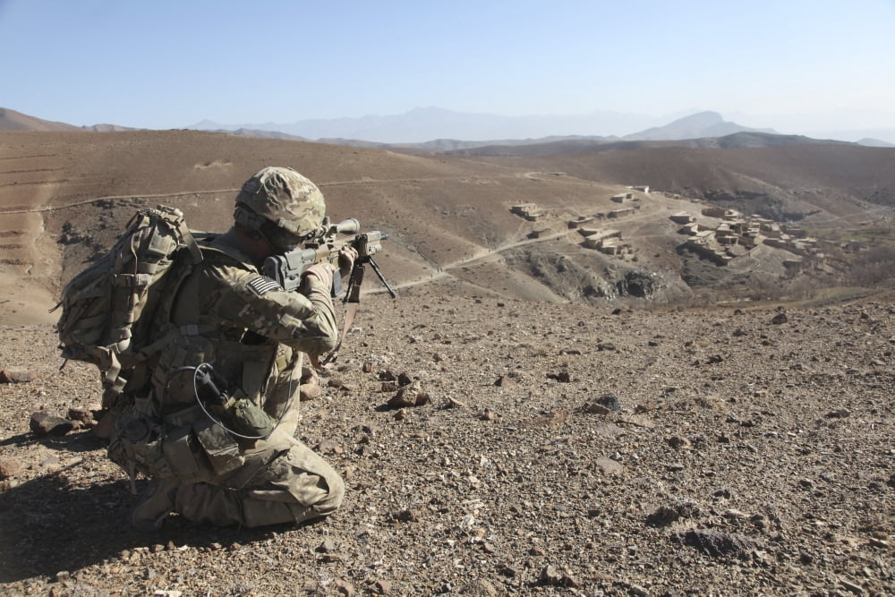 US Army soldier provides security for infantry patrolling through Dandarh village Afghanistan Canvas Art - Stocktrek Images (35 x 24)