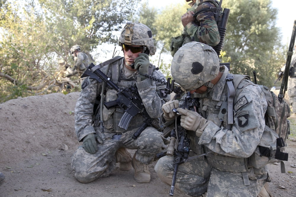 US Army soldier radios in his teams status Canvas Art - Stocktrek Images (34 x 23)