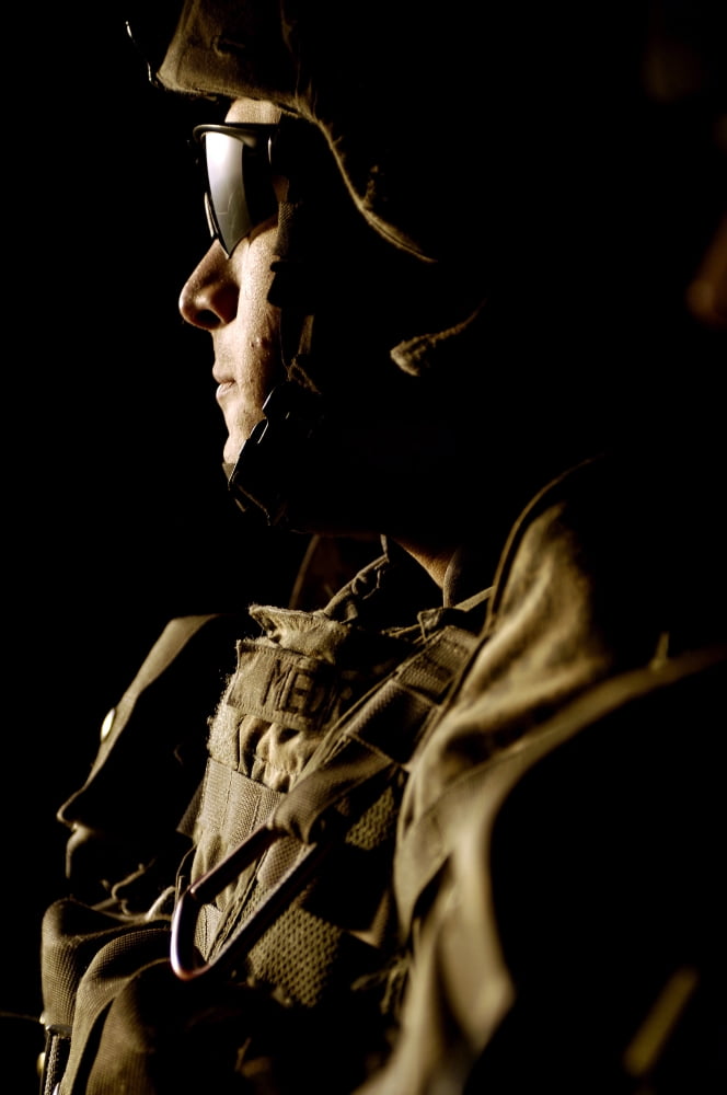US Army soldier scans his sector aboard a UH-60 Black Hawk helicopter Canvas Art - Stocktrek Images (23 x 34)