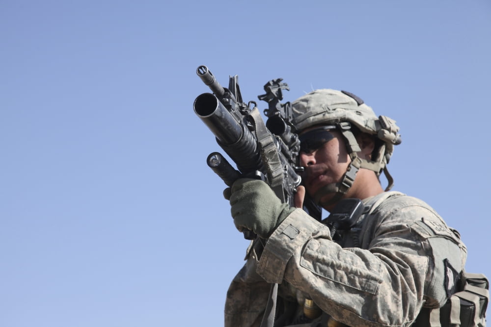 US Army soldier scans the area with an M203 grenade launcher Canvas Art - Stocktrek Images (34 x 23)