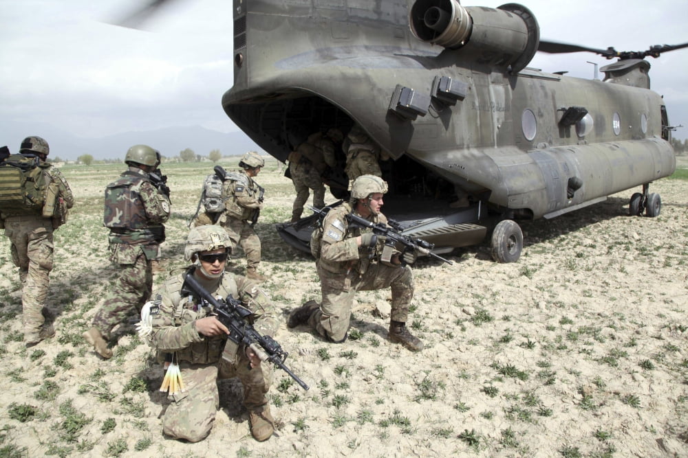 US Army soldiers board a CH-47 Chinook helicopter in Afghanistan Canvas Art - Stocktrek Images (34 x 23)