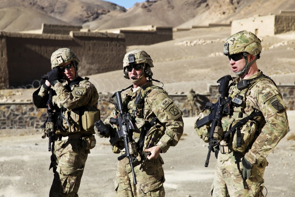US Army soldiers coordinate security in Afghanistan Canvas Art - Stocktrek Images (34 x 23)