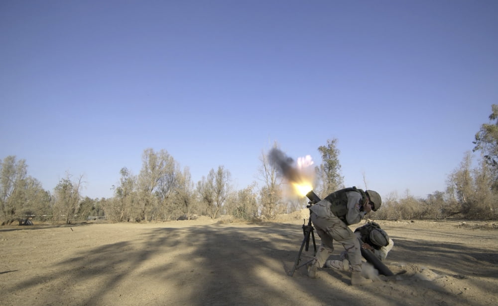 US Army soldiers firing a 120-millimeter mortar round from Forward Operating Base Wilson in Iraq Canvas Art - Stocktrek Images (36 x 22)