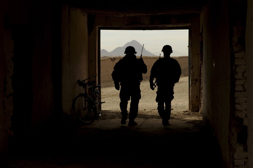 US Army soldiers patrol a village in Afghanistan Canvas Art - Stocktrek Images (35 x 23)
