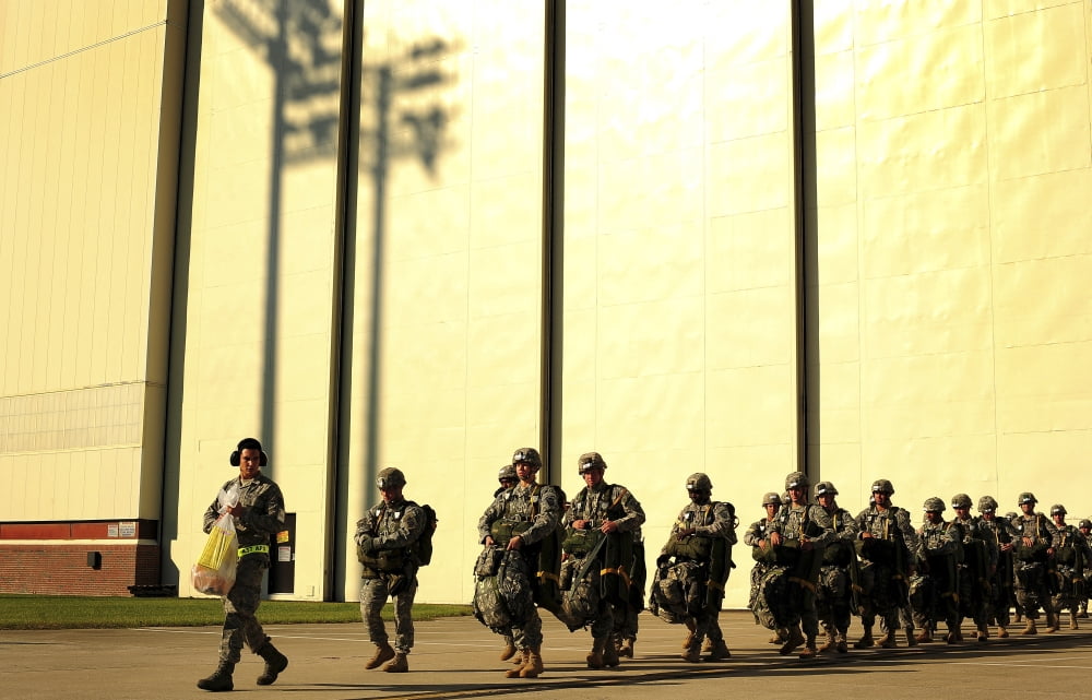 US Army soldiers prepare to board a C-17 Globemaster III Canvas Art - Stocktrek Images (35 x 22)