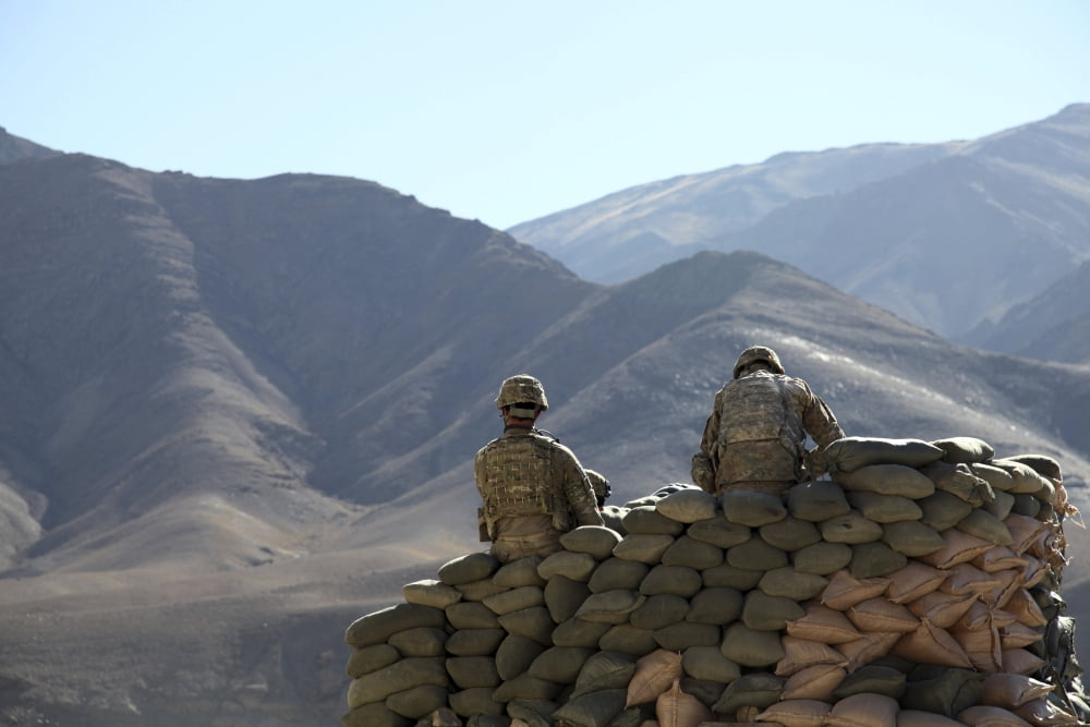 US Army soldiers run communications equipment from a sandbag bunker in Afghanistan Canvas Art - Stocktrek Images (34 x 23)