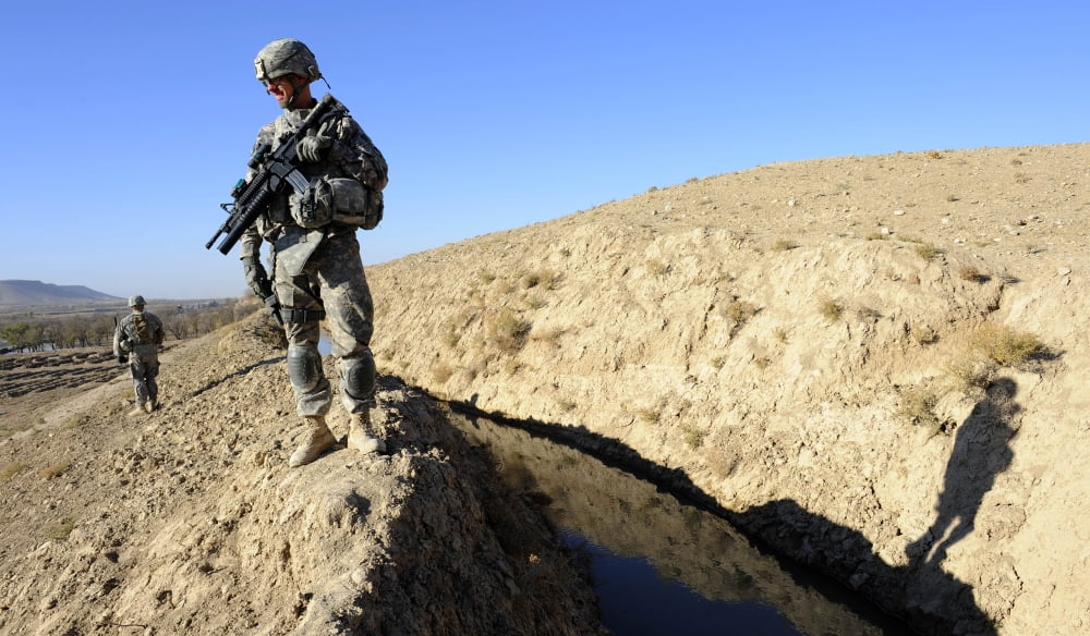 US Army soldiers secure a section of canal in Zabul Afghanistan Canvas Art - Stocktrek Images (37 x 22)