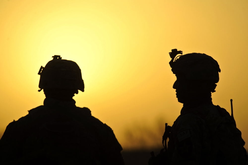 US Army soldiers silhouetted against the morning sun in Afghanistan Canvas Art - Stocktrek Images (35 x 23)