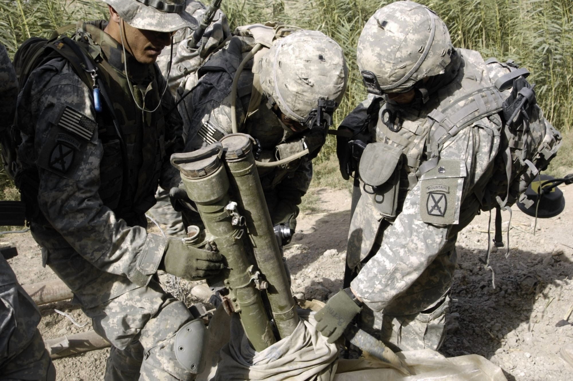 US Army soldiers uncovering anti-tank missiles and launchers at a remote village outside Baghdad Iraq Canvas Art - Stocktrek Images (35 x 23)