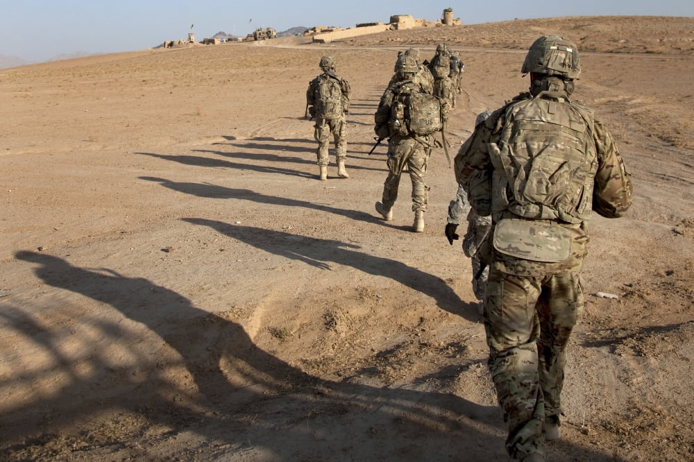 US Army soldiers walk toward a checkpoint in Afghanistan Canvas Art - Stocktrek Images (35 x 23)