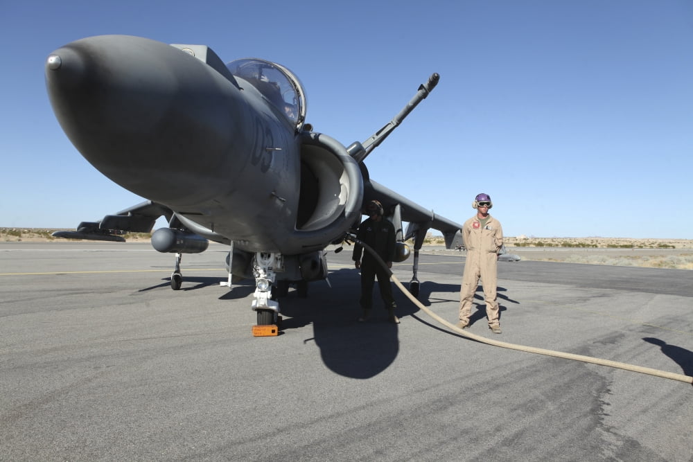 US Marine Corps air crewmen refuel an AV-8B Harrier II aircraft Canvas Art - Stocktrek Images (34 x 23)