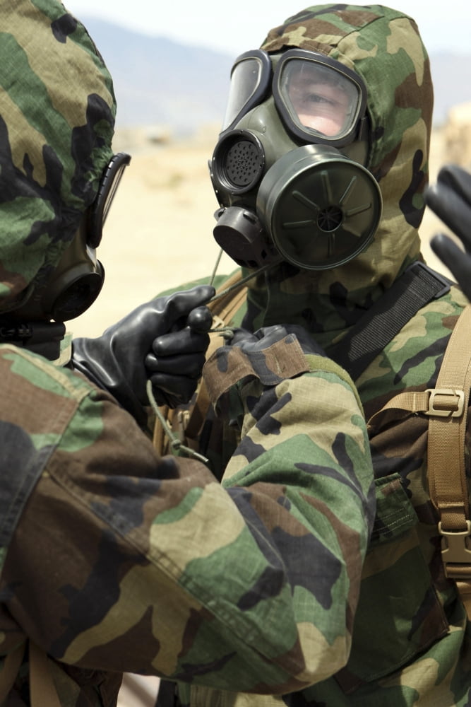 US Marine Corps reservists in camouflage and gas masks assisting each other with their hood straps Canvas Art - Stocktrek Images (23 x 34)