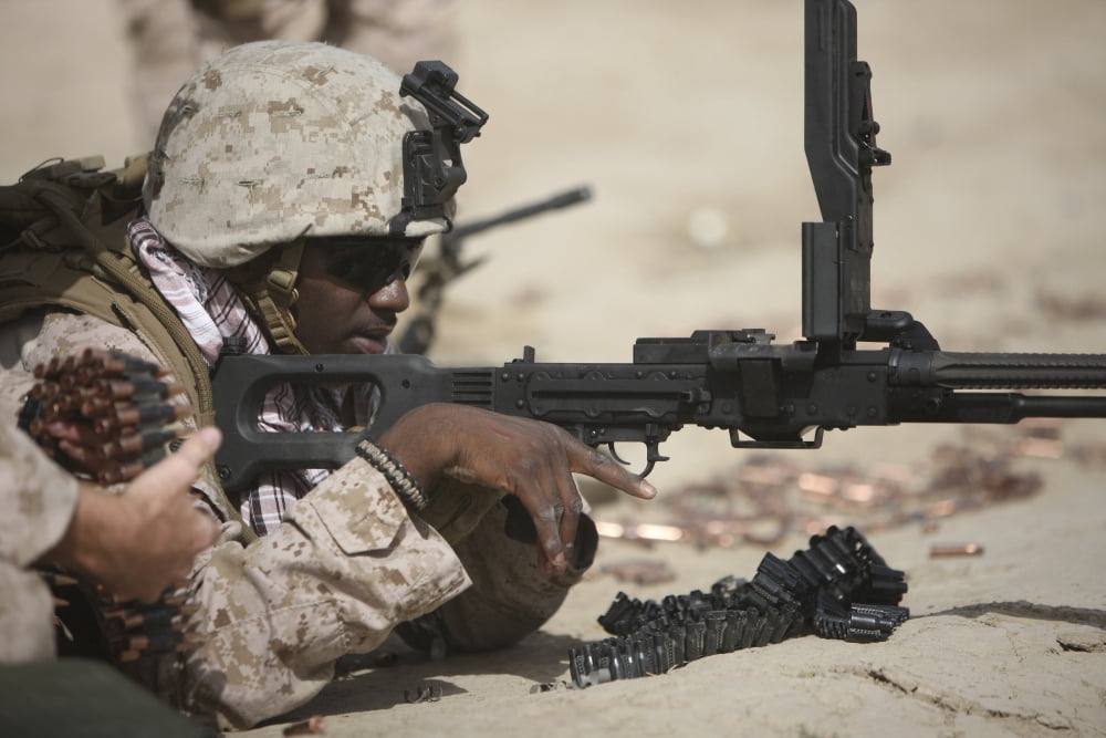 US Marine clears the feed tray on the PK machine gun Canvas Art - Terry MooreStocktrek Images (35 x 24)