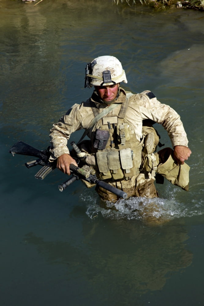 US Marine crosses a stream during a security patrol in Afghanistan Canvas Art - Stocktrek Images (23 x 34)