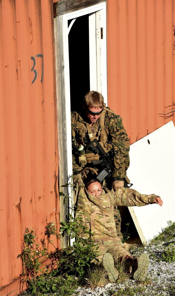 US Marine drags an injured patient to safety Canvas Art - Stocktrek Images (22 x 36)