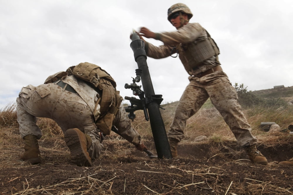 US Marine drops a mortar round into an M252 81mm mortar system Canvas Art - Stocktrek Images (35 x 24)