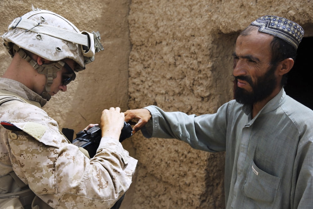 US Marine enrolls an Afghan into the Secure Electronic Enrollment Kit Canvas Art - Stocktrek Images (35 x 23)