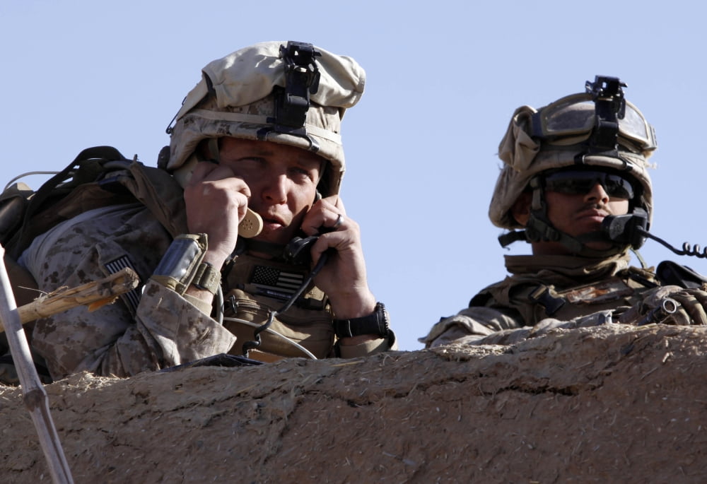 US Marine gives directions to units on two different radios from a rooftop in Afghanistan Canvas Art - Stocktrek Images (34 x 23)