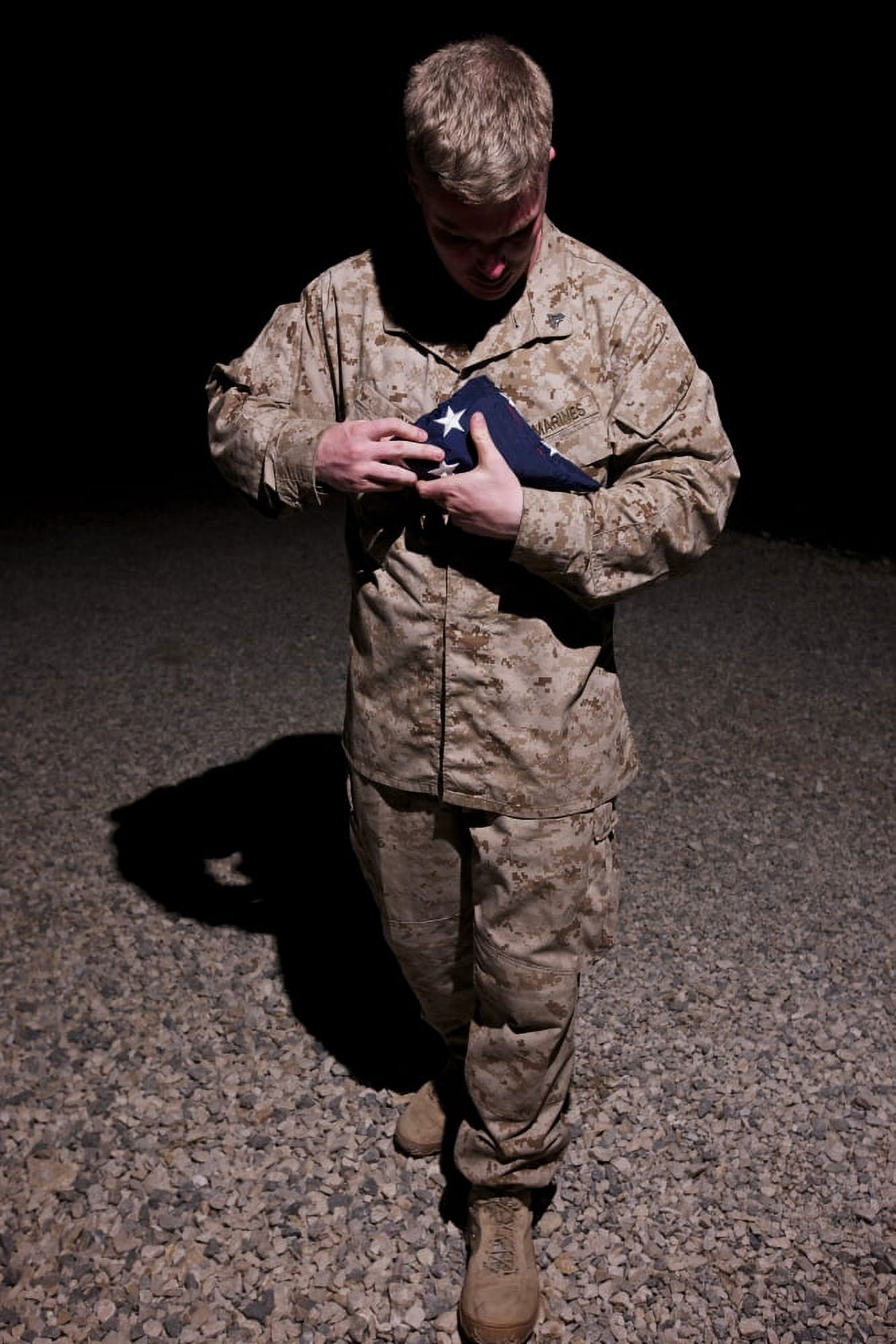US Marine holding the American Flag Canvas Art - Terry MooreStocktrek Images (24 x 35)