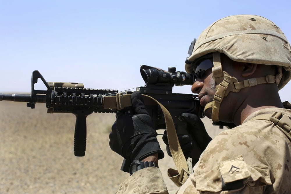 US Marine holds security during a patrol in Afghanistan Canvas Art - Stocktrek Images (34 x 23)