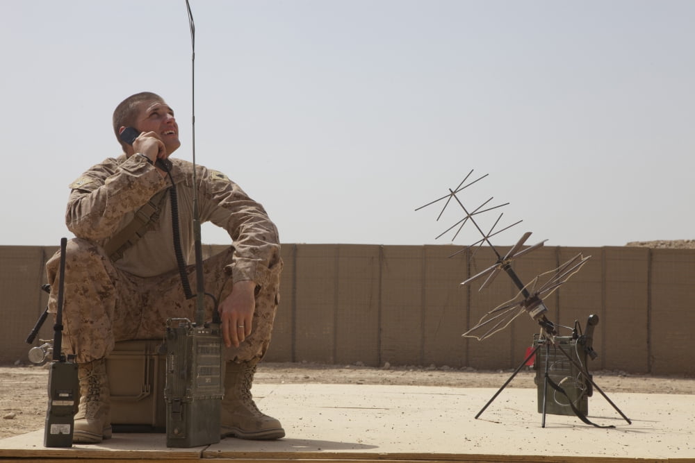 US Marine looks up to the sky while using satellite tactical communications equipment Canvas Art - Stocktrek Images (35 x 23)