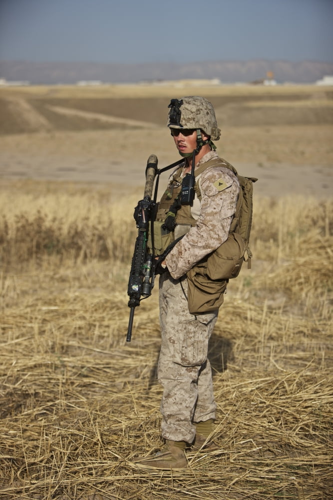 US Marine patrols a wadi near Kunduz Afghanistan Canvas Art - Terry MooreStocktrek Images (12 x 18)