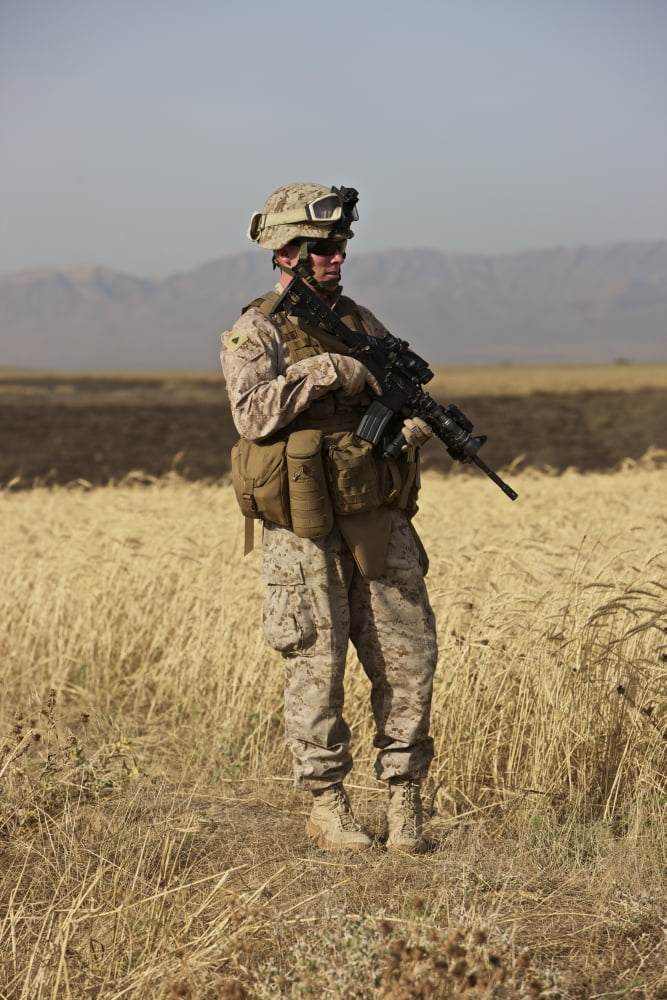 US Marine patrols a wadi near Kunduz Afghanistan Canvas Art - Terry MooreStocktrek Images (12 x 18)
