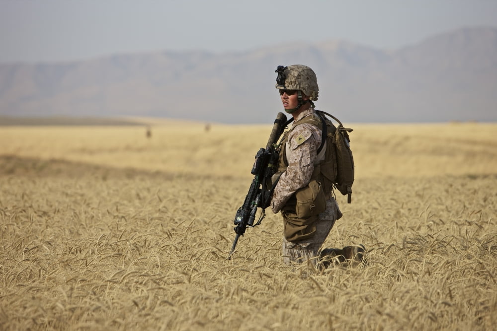 US Marine patrols a wadi near Kunduz Afghanistan Canvas Art - Terry MooreStocktrek Images (18 x 12)
