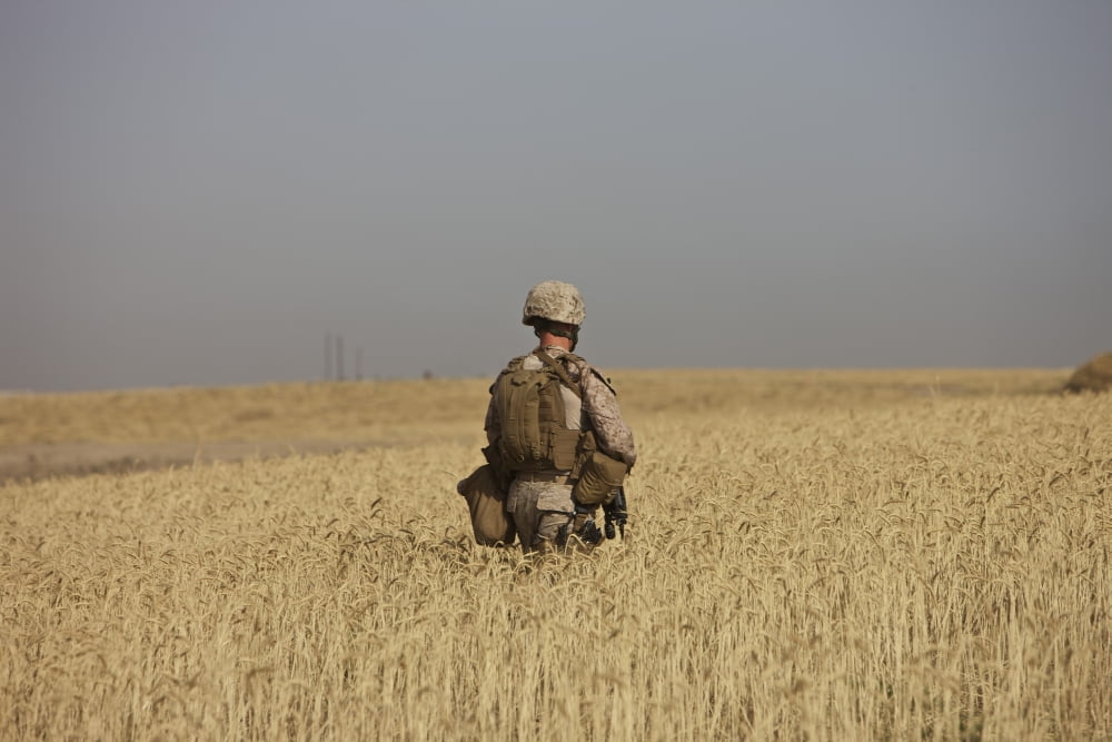 US Marine patrols a wadi near Kunduz Afghanistan Canvas Art - Terry MooreStocktrek Images (18 x 12)