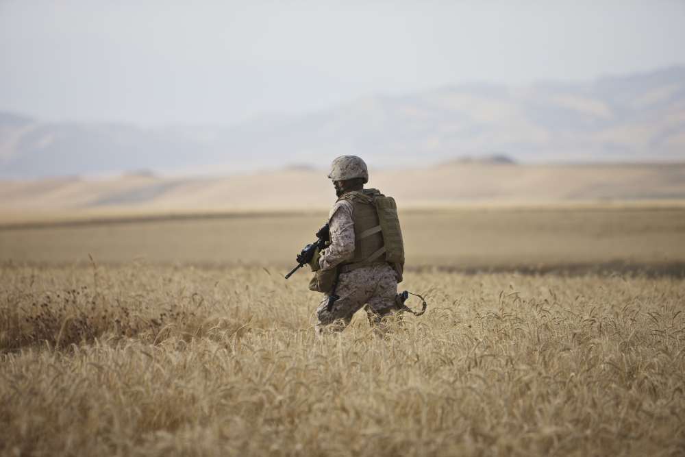 US Marine patrols a wadi near Kunduz Afghanistan Canvas Art - Terry MooreStocktrek Images (18 x 12)