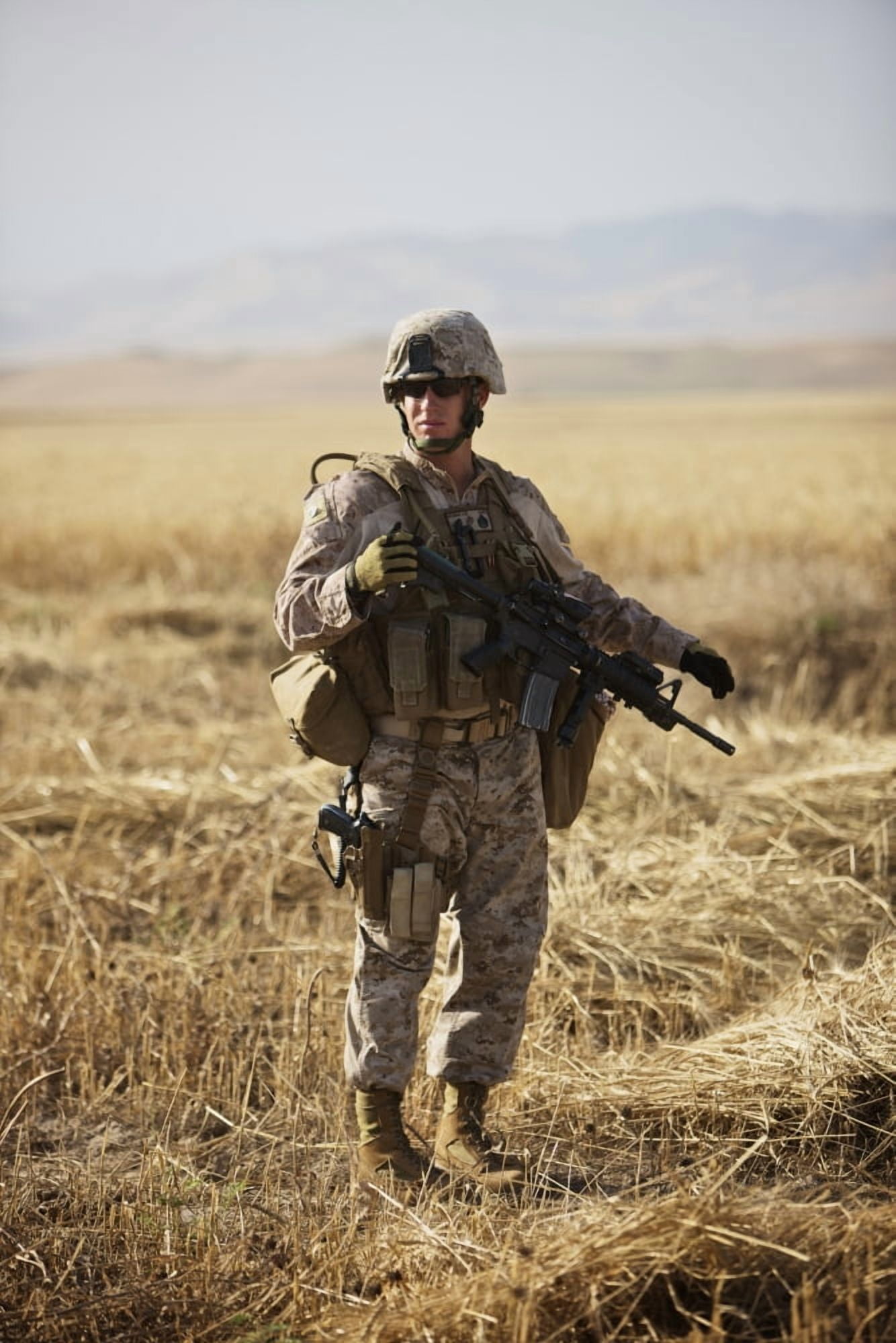 US Marine patrols a wadi near Kunduz Afghanistan Canvas Art - Terry MooreStocktrek Images (23 x 35)