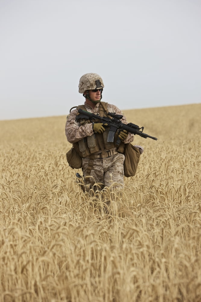 US Marine patrols a wadi near Kunduz Afghanistan Canvas Art - Terry MooreStocktrek Images (24 x 35)