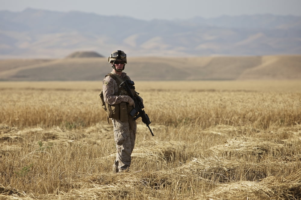 US Marine patrols a wadi near Kunduz Afghanistan Canvas Art - Terry MooreStocktrek Images (35 x 23)