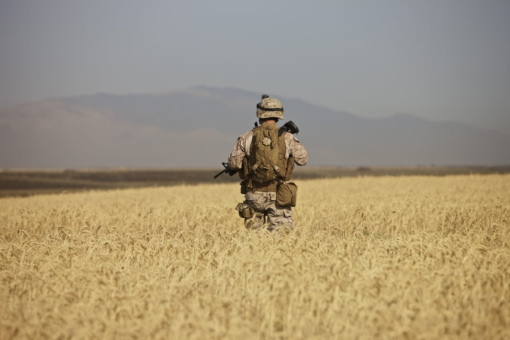 US Marine patrols a wadi near Kunduz Afghanistan Canvas Art - Terry MooreStocktrek Images (35 x 24)