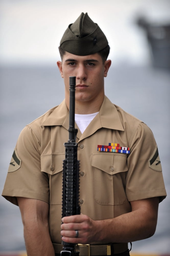 US Marine presents arms during an anniversary ceremony Canvas Art - Stocktrek Images (23 x 35)