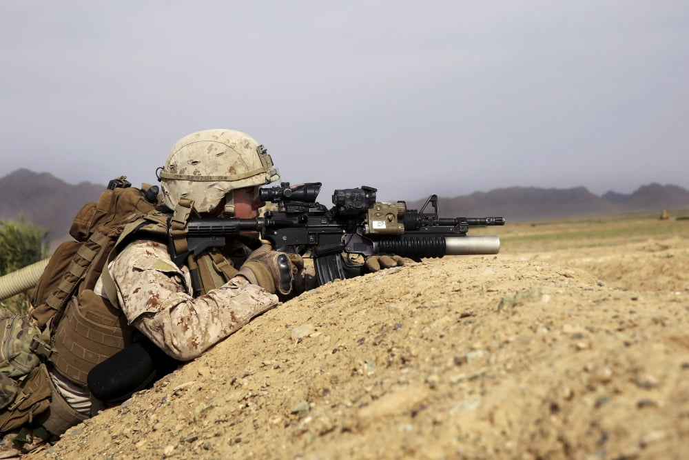 US Marine provides security from the berm of a field in Afghanistan Canvas Art - Stocktrek Images (34 x 23)