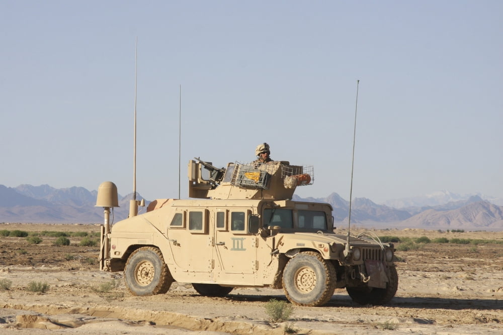 US Marine stands ready behind his vehicle-mounted machine gun Canvas Art - Stocktrek Images (35 x 24)