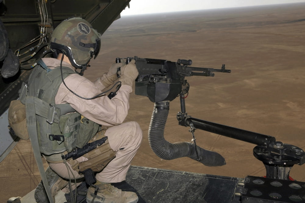 US Marine test firing an M240 heavy machine gun on the back of a MV-22B Osprey Canvas Art - Stocktrek Images (34 x 23)