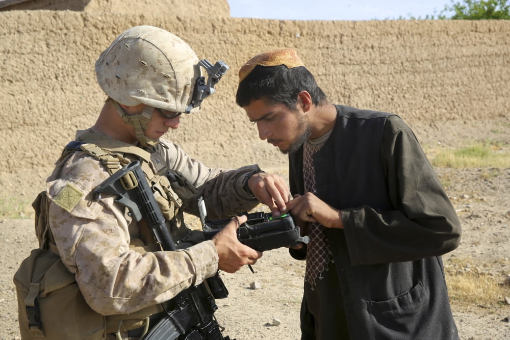 US Marine utilizes a Biometric Enrollment and Screening Device Canvas Art - Stocktrek Images (34 x 23)