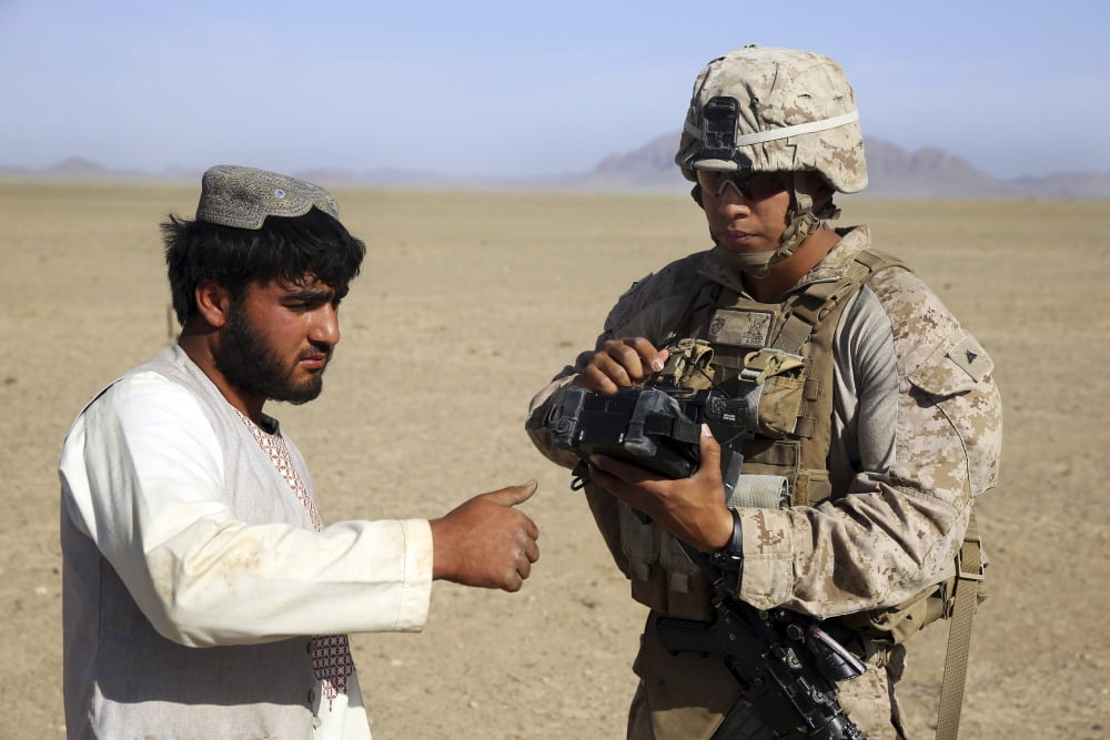 US Marine utilizes a Biometric Enrollment and Screening Device Canvas Art - Stocktrek Images (34 x 23)
