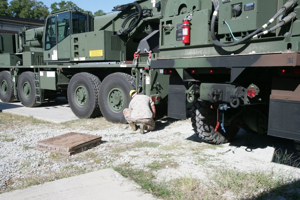 US Marine works on a Kalmar Rough Terrain vehicle Canvas Art - Stocktrek Images (35 x 23)