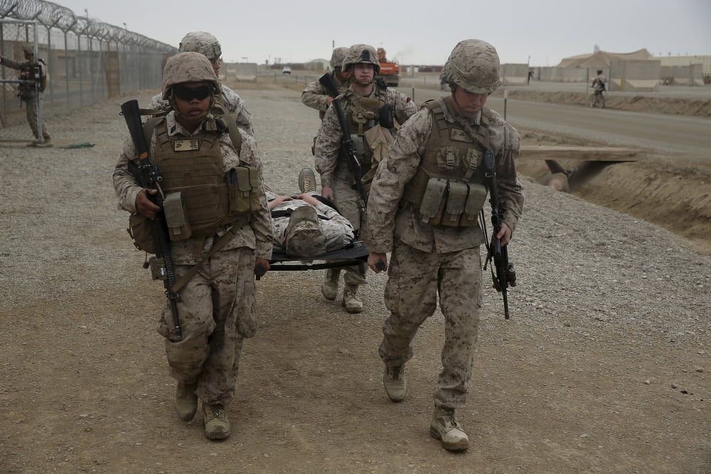 US Marines and Navy corpsmen evacuate a simulated casualty Canvas Art - Stocktrek Images (34 x 23)