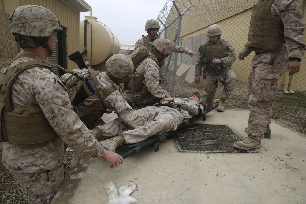 US Marines and Navy corpsmen treat a simulated casualty Canvas Art - Stocktrek Images (34 x 23)
