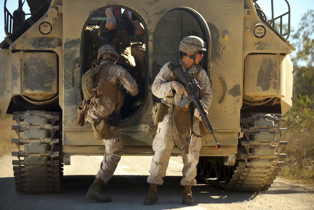 US Marines climb into the back of an amphibious assault vehicle Canvas Art - Stocktrek Images (35 x 23)