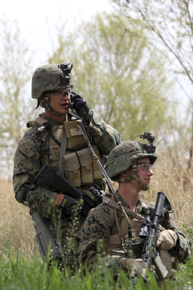 US Marines communicate with their patrol base during a security patrol in Afghanistan Canvas Art - Stocktrek Images (24 x 35)