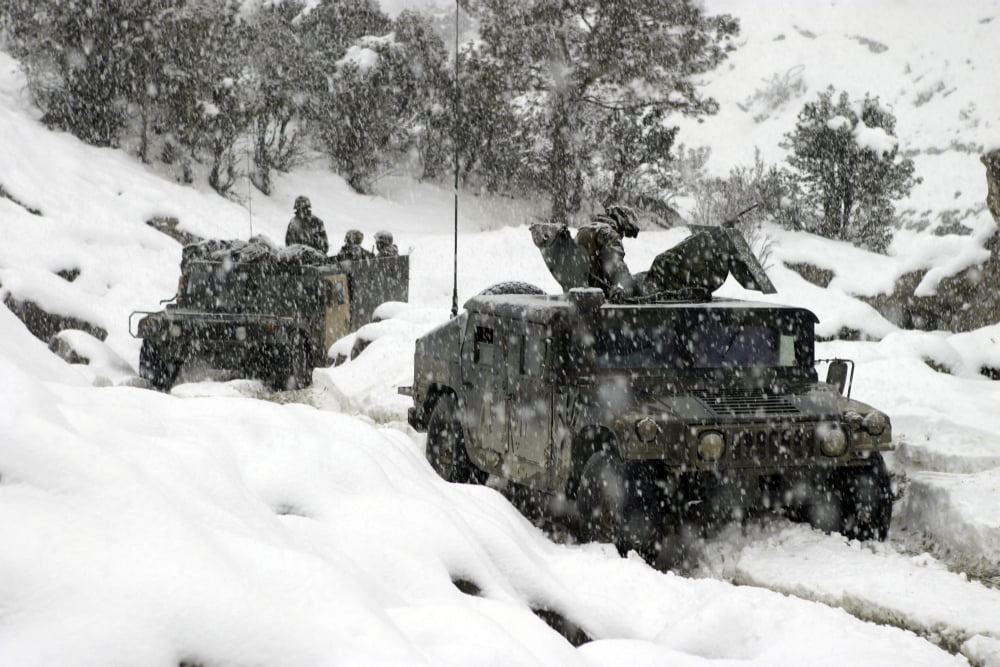 US Marines conducting a mounted patrol in the snowy weather of the Khowst-Gardez Pass in Afghanistan Canvas Art - Stocktrek Images (34 x 23)
