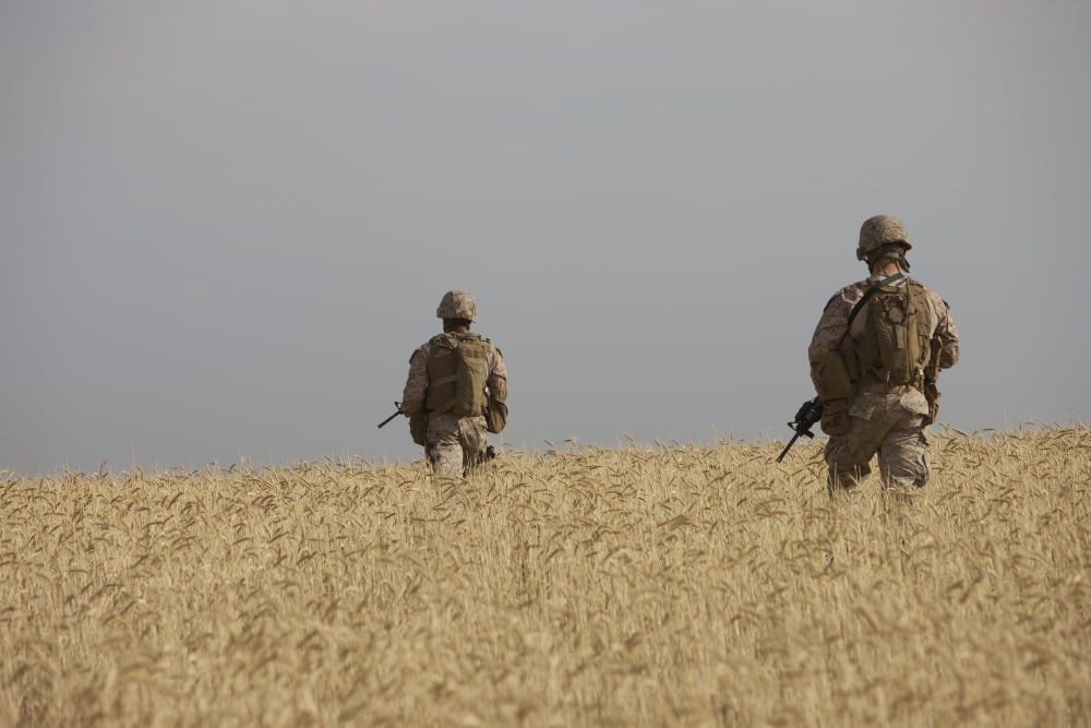 US Marines patrol a wadi near Kunduz Afghanistan Canvas Art - Terry MooreStocktrek Images (18 x 12)