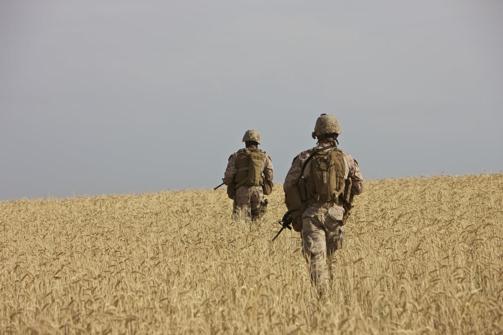 US Marines patrol a wadi near Kunduz Afghanistan Canvas Art - Terry MooreStocktrek Images (18 x 12)